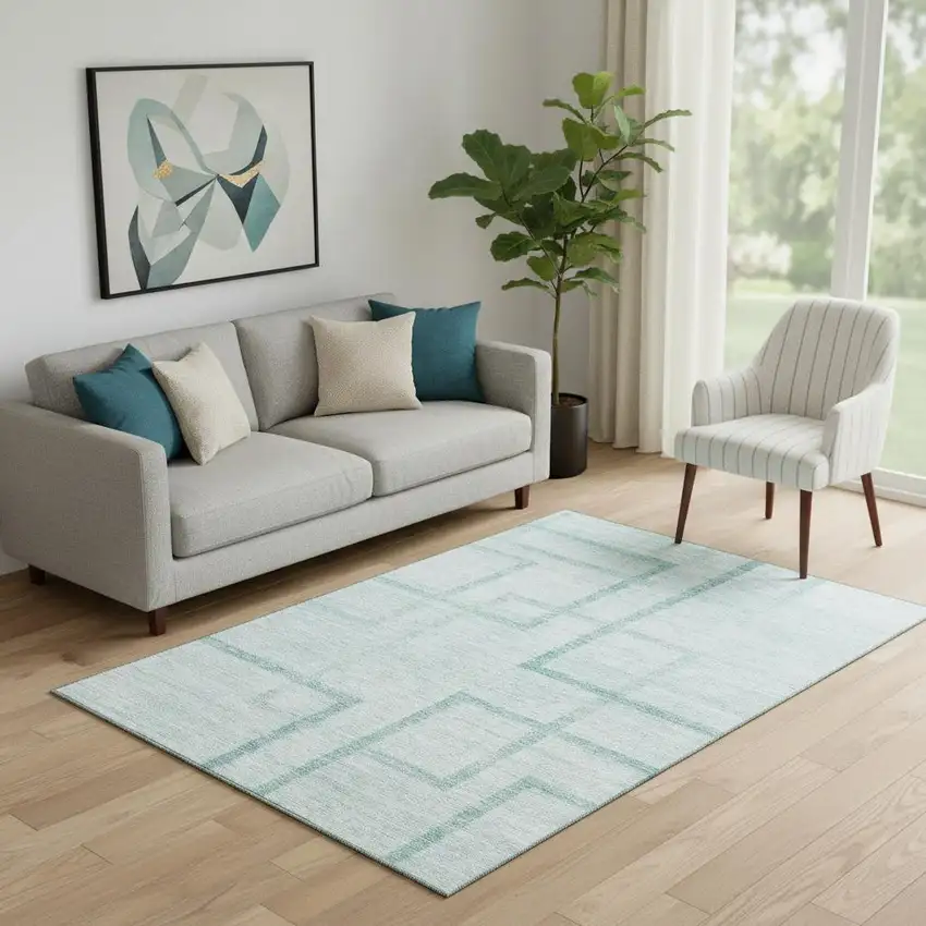 Teal And Ivory Geometric Washable Area Rug With UV Protection Photo 1