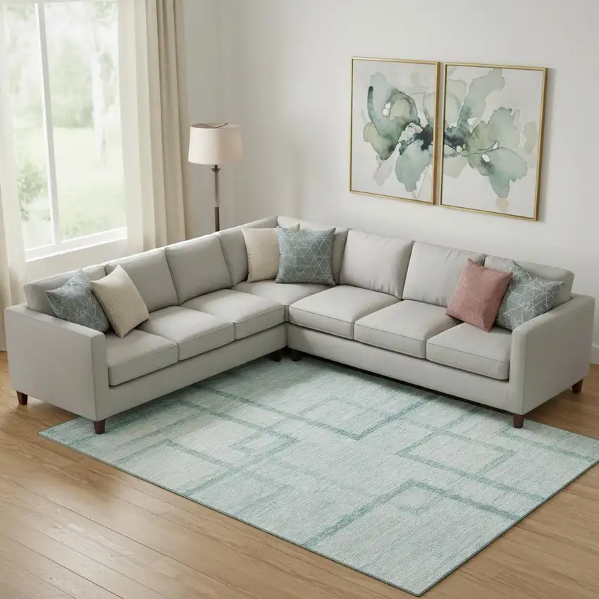 Teal And Ivory Geometric Washable Area Rug With UV Protection Photo 1