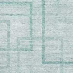 Photo of Teal And Ivory Geometric Washable Area Rug With UV Protection