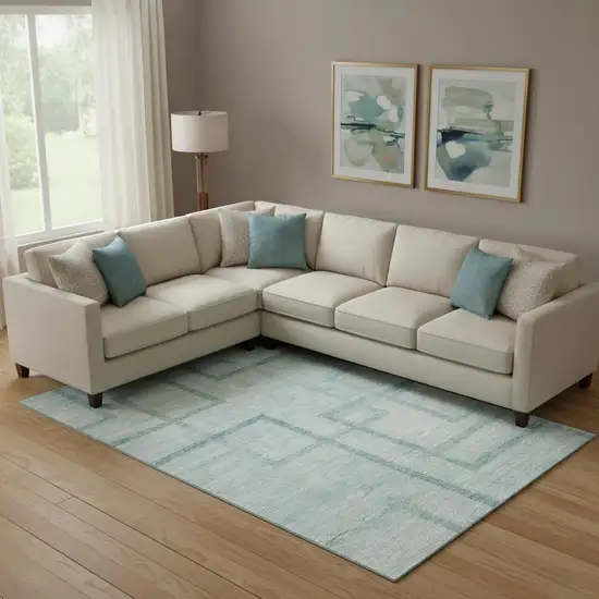 Teal And Ivory Geometric Washable Area Rug With UV Protection Photo 1