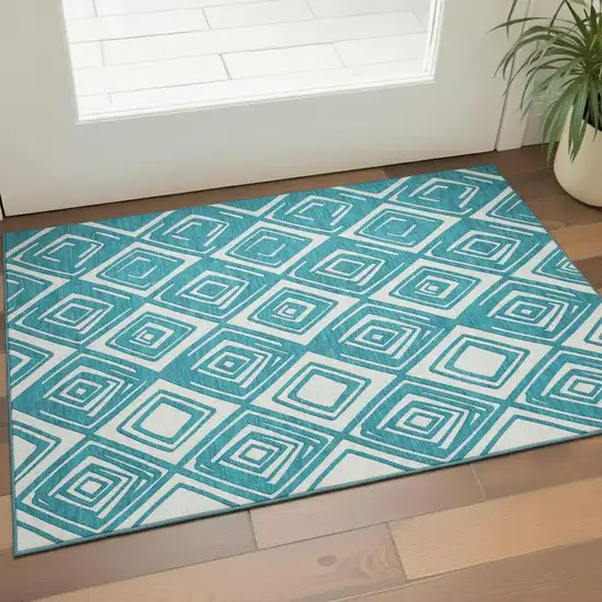 Teal And Ivory Geometric Washable Area Rug With UV Protection Photo 1