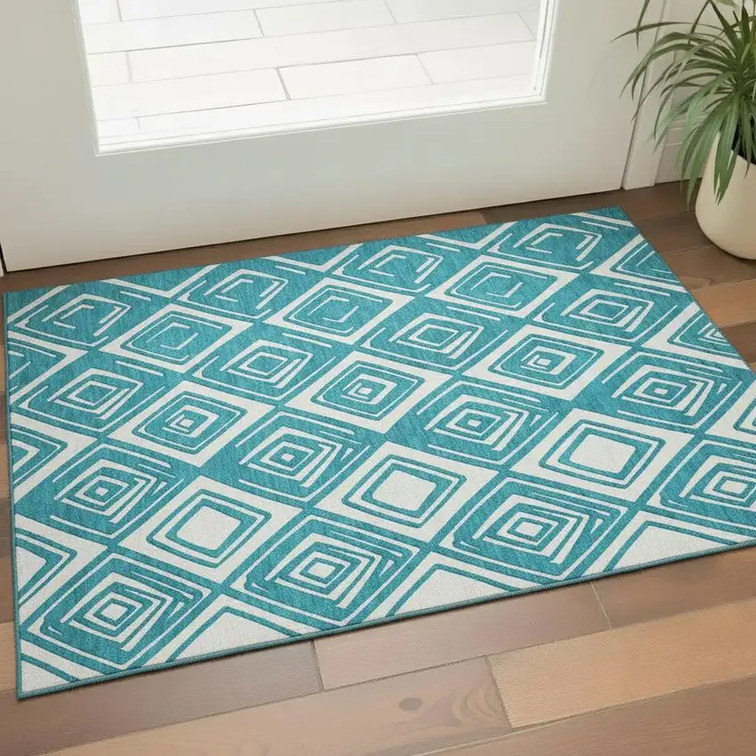 Teal And Ivory Geometric Washable Area Rug With UV Protection Photo 1