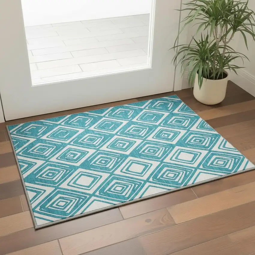 Teal And Ivory Geometric Washable Area Rug With UV Protection Photo 1
