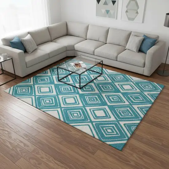Teal And Ivory Geometric Washable Area Rug With UV Protection Photo 1
