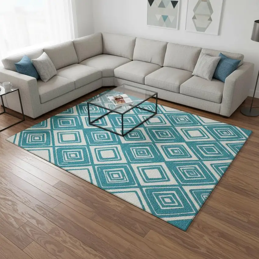 Teal And Ivory Geometric Washable Area Rug With UV Protection Photo 1