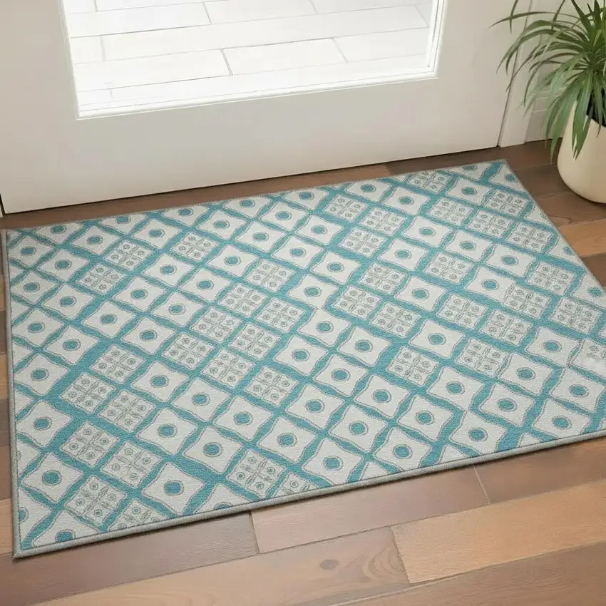 Teal And Ivory Geometric Washable Area Rug With UV Protection Photo 1