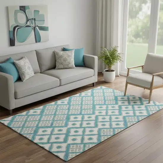 Teal And Ivory Geometric Washable Area Rug With UV Protection Photo 1
