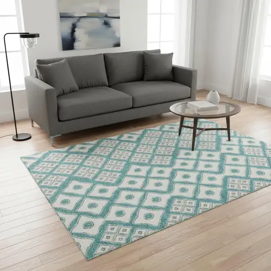 Teal And Ivory Geometric Washable Area Rug With UV Protection Photo 1