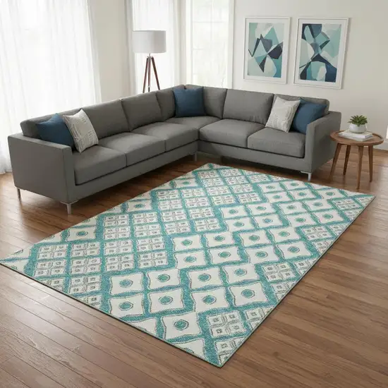 Teal And Ivory Geometric Washable Area Rug With UV Protection Photo 1