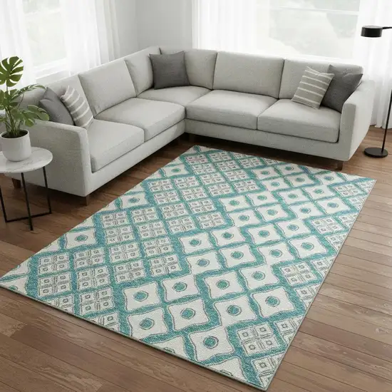 Teal And Ivory Geometric Washable Area Rug With UV Protection Photo 1