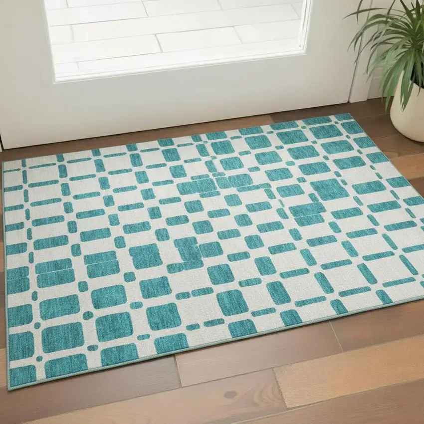 Teal And Ivory Geometric Washable Area Rug With UV Protection Photo 1