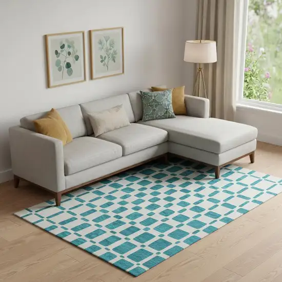 Teal And Ivory Geometric Washable Area Rug With UV Protection Photo 1
