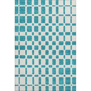 Photo of Teal And Ivory Geometric Washable Area Rug With UV Protection