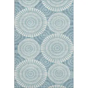 Photo of Teal And Ivory Geometric Washable Area Rug With UV Protection