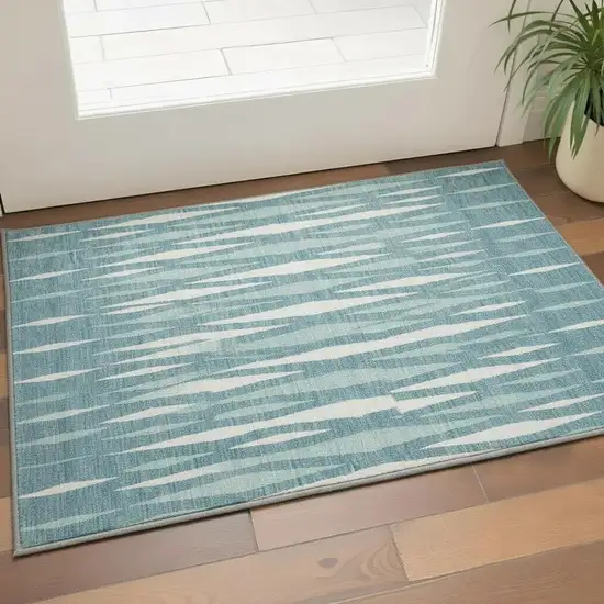 Teal And Ivory Geometric Washable Area Rug With UV Protection Photo 2