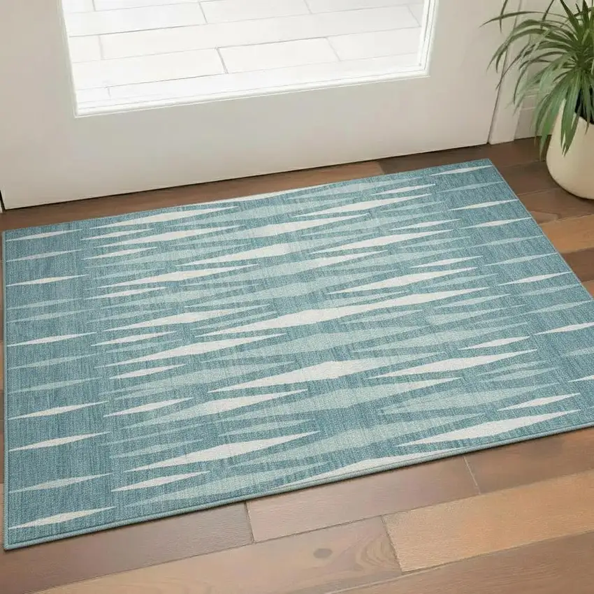 Teal And Ivory Geometric Washable Area Rug With UV Protection Photo 1