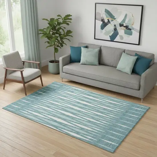 Teal And Ivory Geometric Washable Area Rug With UV Protection Photo 1