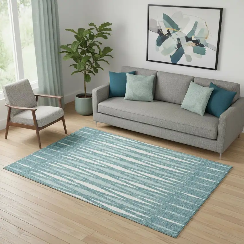 Teal And Ivory Geometric Washable Area Rug With UV Protection Photo 1