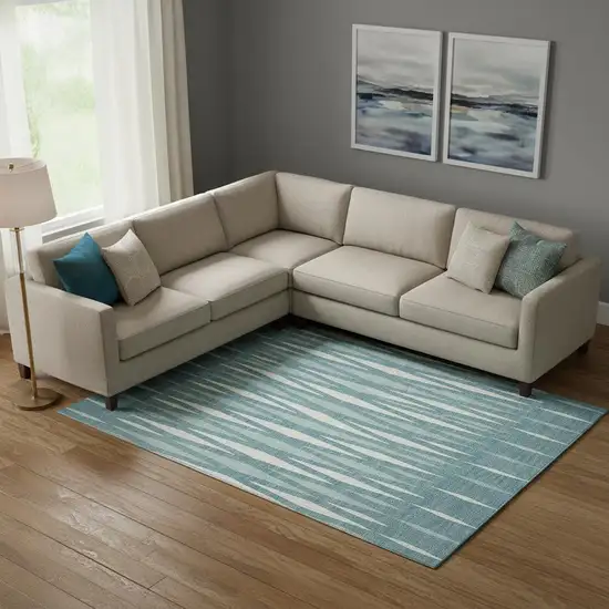 Teal And Ivory Geometric Washable Area Rug With UV Protection Photo 1