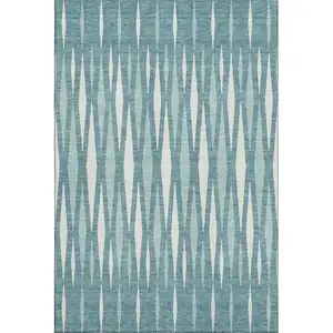 Photo of Teal And Ivory Geometric Washable Area Rug With UV Protection