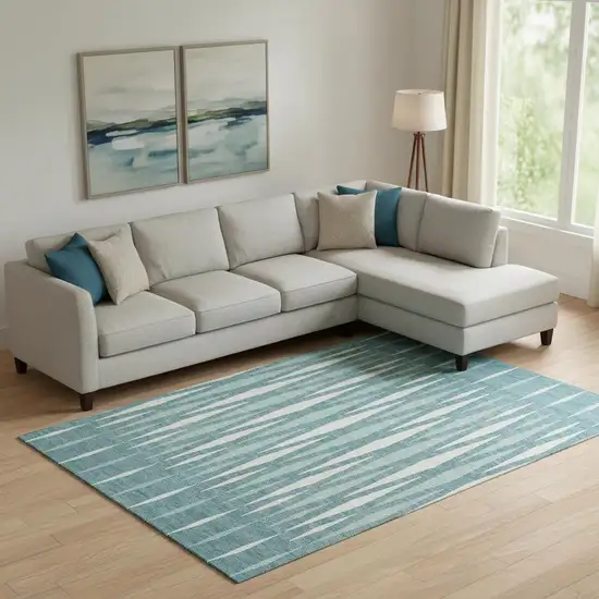 Teal And Ivory Geometric Washable Area Rug With UV Protection Photo 1