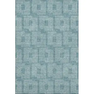 Photo of Teal And Ivory Geometric Washable Area Rug With UV Protection