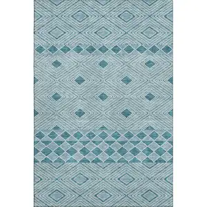 Photo of Teal And Ivory Geometric Washable Area Rug With UV Protection