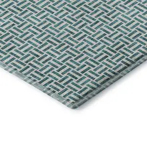 Photo of Teal And Ivory Geometric Washable Area Rug With UV Protection