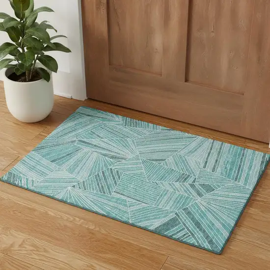 Teal And Ivory Geometric Washable Area Rug With UV Protection Photo 1