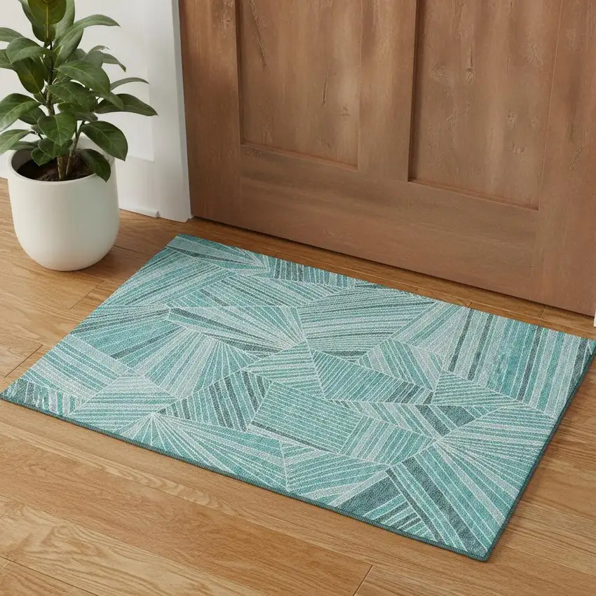 Teal And Ivory Geometric Washable Area Rug With UV Protection Photo 1