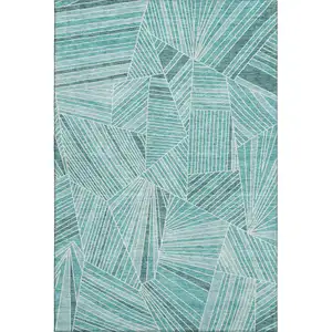 Photo of Teal And Ivory Geometric Washable Area Rug With UV Protection