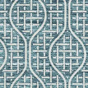 Photo of Teal And Ivory Geometric Washable Area Rug With UV Protection