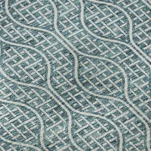 Photo of Teal And Ivory Geometric Washable Area Rug With UV Protection