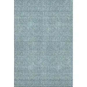 Photo of Teal And Ivory Geometric Washable Area Rug With UV Protection