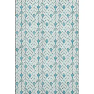 Photo of Teal And Ivory Geometric Washable Area Rug With UV Protection
