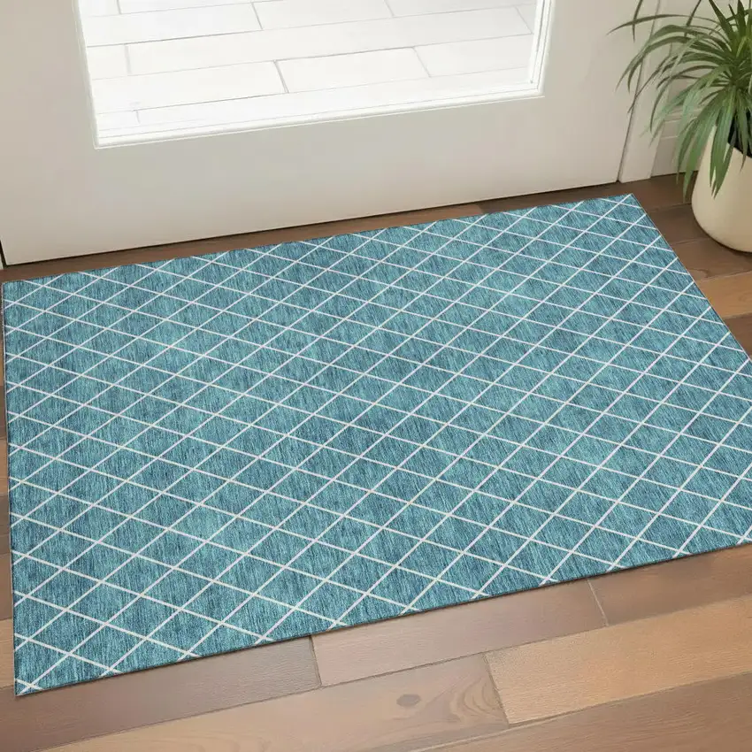 Teal And Ivory Geometric Washable Area Rug With UV Protection Photo 1