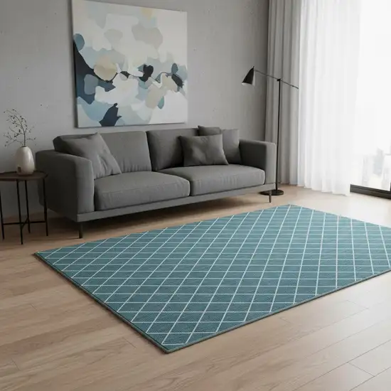 Teal And Ivory Geometric Washable Area Rug With UV Protection Photo 2