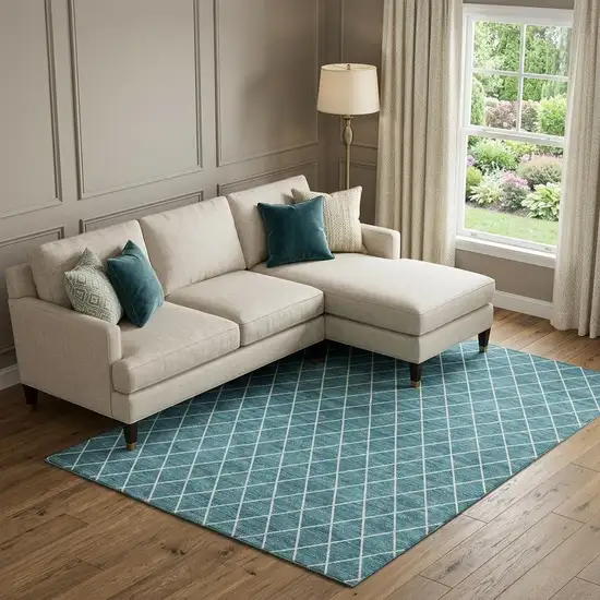 Teal And Ivory Geometric Washable Area Rug With UV Protection Photo 1