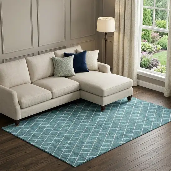 Teal And Ivory Geometric Washable Area Rug With UV Protection Photo 1