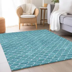 Photo of Teal And Ivory Geometric Washable Area Rug With UV Protection