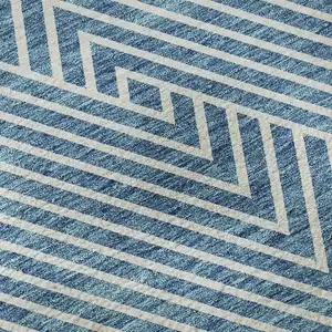 Photo of Teal And Ivory Geometric Washable Area Rug With UV Protection