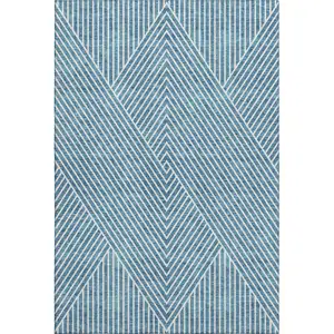 Photo of Teal And Ivory Geometric Washable Area Rug With UV Protection