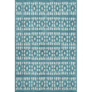 Photo of Teal And Ivory Geometric Washable Area Rug With UV Protection
