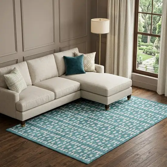 Teal And Ivory Geometric Washable Area Rug With UV Protection Photo 1