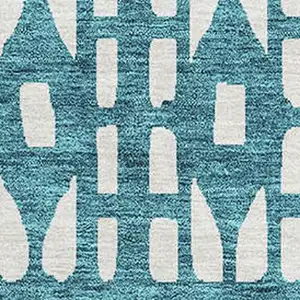 Photo of Teal And Ivory Geometric Washable Area Rug With UV Protection