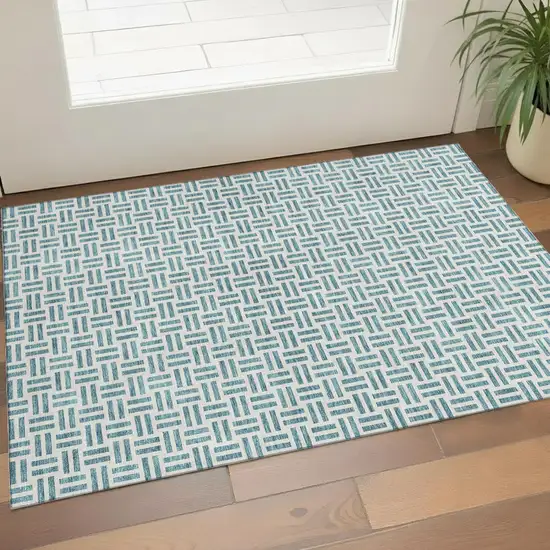 Teal And Ivory Geometric Washable Area Rug With UV Protection Photo 1