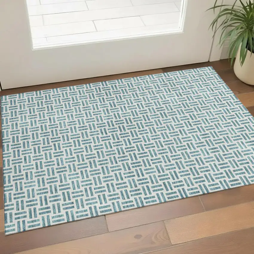 Teal And Ivory Geometric Washable Area Rug With UV Protection Photo 1