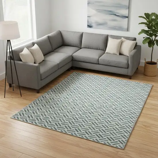 Teal And Ivory Geometric Washable Area Rug With UV Protection Photo 2
