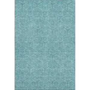 Photo of Teal And Ivory Geometric Washable Area Rug With UV Protection