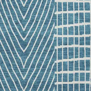 Photo of Teal And Ivory Geometric Washable Area Rug With UV Protection